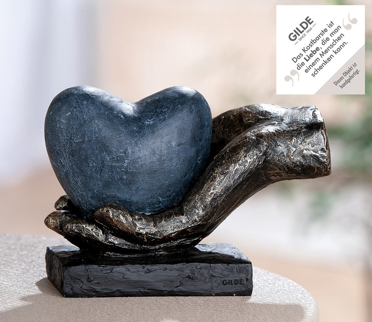 Skulptur Hand mit Herz bronzefarben