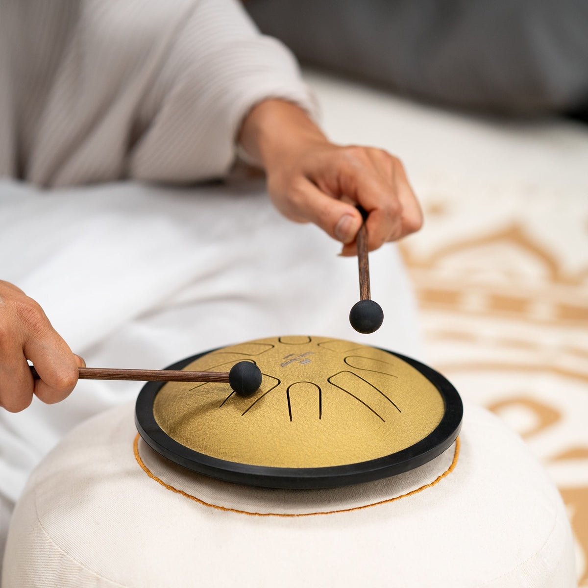 Small Steel Tongue Drum Gold while playing